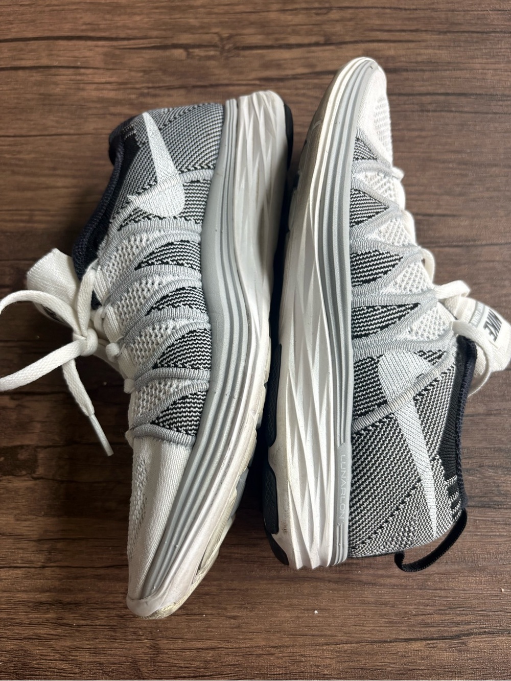 Nike Women’s White and Black Flyknit Sneakers - Picture 2 of 7